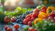 © Jiraphat - A close-up shot of vibrant red tomatoes on display at a farmers market, surrounded by other fresh produce.