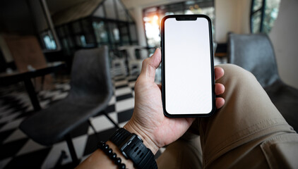 Wall Mural - man hand holding smartphone with blank screen
