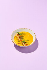 Sticker - Gourmet Pumpkin Cream Soup with Shrimp on Light Pink Background