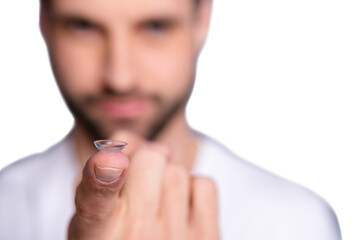 Wall Mural - Close up photo of charming lovely serious focused guy have medical service want good eye vision look perfect index finger wear white clothing isolated grey background