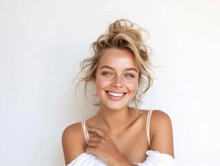 Wall Mural - Young blonde woman with a beautiful smile on a gray background. Feminine beauty. Natural smile. Healthy teeth.