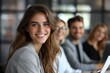 © Sandu - Smiling woman with glasses in front of group