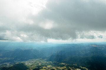 Poster - Moving white clouds blue sky scenic aerial view through summer. Drone slide turn flies forward high in blue sky through fluffy clouds on the panorama