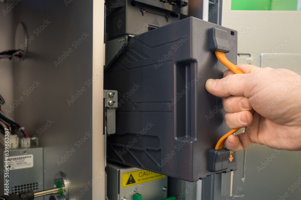 installation of the cassette in the deposit module of the terminal for ...