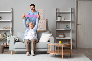 Sticker - Senior woman with stretching band and physical therapist at home