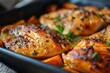 © Konstiantyn Zap - Close-up of a pan filled with juicy chicken pieces and colorful sweet potatoes cooking to perfection