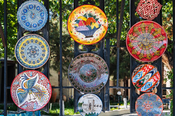 Wall Mural - traditional Asian Arab Uzbek ceramic plates hand-painted in street in Uzbekistan in Tashkent