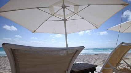 Wall Mural - Caribbean beach with sun umbrellas and sunbeds. Tropical Vacation. Summer holidays