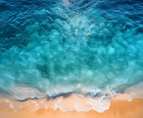 Wall Mural - Aerial view of sandy beach and ocean with waves. Blue water background in summertime