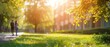 © Naret - Couple walking on a sunlit path surrounded by green trees and grass near an apartment building on a clear day.