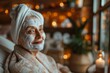 © Dina - woman at spa with face mask treatment on, closeup with salon bokeh background with copy space. Christmas time self love ritual.