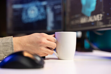 Poster - Man at home enjoying hot beverage, witnessing AI becoming sentient, asking questions about itself. Close up of man holding coffee mug, talking with artificial intelligence becoming self aware