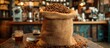 © Henry - Fresh coffee beans spilling out of burlap sack in cozy cafe setting