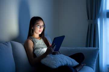 Sticker - Woman with glasses and watch on tablet computer at home