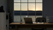 © bongkarn - A modern private office room at sunset, a laptop computer on a table near the window.