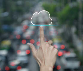 Poster - Hand click on cloud computing icon with copy space over blur of rush hour with cars and road in city, Technology cloud computing concept