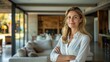 © Антон Сальников - This confident European woman agent stands proudly inside a modern home and is ready to assist prospective buyers with any questions they might have.