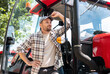 © Barillo Images - Portrait of man agricultural tractor driver in countryside.