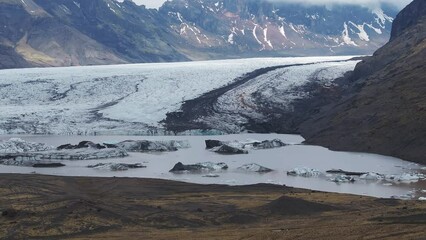 Wall Mural - Aerial beautiful spring day view of Svínafellsjökull Glacier, Iceland. Skaftafell glacier, Vatnajokull National Park in Iceland.