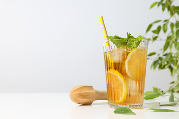 Wall Mural - A glass of cold tea with fresh orange slices