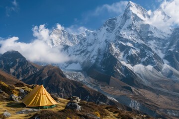 Poster - A tent pitched up in the mountains with a mountain in the background, suitable for outdoor adventures or travel photography