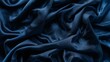© พงศ์พล วันดี - Close-up of smooth shiny blue satin fabric
