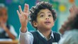 © BURINKUL - A student in a school uniform raising their hand to answer a question during an interactive lesson