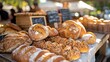 © Darya - A close-up of freshly baked artisan bread displayed at a local farmers market