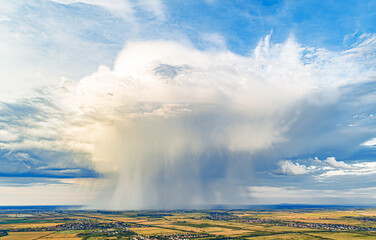 Wall Mural - Rain cloud and horizon line. Drone photo.