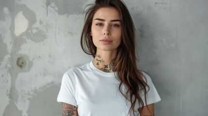 Poster - Beautiful girl with tattoos, light concrete background, oversized white style t-shirt mockup