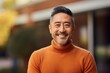 © CogniLens - Portrait of a glad asian man in his 40s wearing a classic turtleneck sweater while standing against pastel brown background