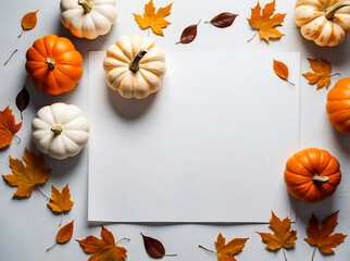 autumn background with pumpkin mock-up composition with a light surface and an orange pumpkin and fall foliage backdrop for fall.