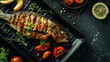 © Korea Saii - Deliciously Grilled Fish Exquisite Whole Fish Dish Garnished with Fresh Herbs, Cherry Tomatoes, and Slices of Lemon on a Black Plate – A Perfect Example of Gourmet Cuisine and Elegant Seafood