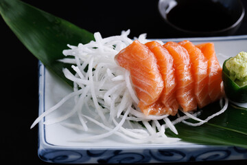 Wall Mural - salmon sashimi japanese seafood japanese sashimi isolated in black background