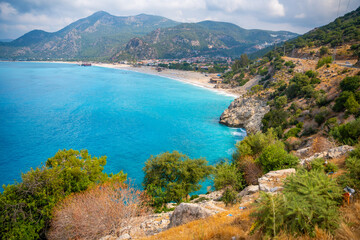 Wall Mural - Aerial view of Oludeniz beach with people and boats in the morning, Coastline next to Fethiye, Turkey