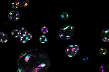 Sticker - Soap bubbles isolated on a black background