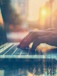 © Johannes - Humans hand typing on laptop keyboard. Blured morning background. Business concept image hyper realistic