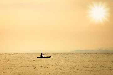 Wall Mural - A beautiful yacht sailing in the sea silhouette background