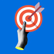 © Morena - Halftone hands holding target with an arrow in the center. Modern collage. Successful business concept. Reach the goal. Darts in hand. Trendy newspaper cut out paper elements