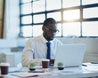 © Nikish Hiraman/peopleimages.com - Finance, documents or African businessman with laptop in office for planning, research or tax, savings or review. Fintech, investment or accountant with glasses for startup, accounting or sale profit