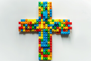 Wall Mural - A cross made of colorful LEGO bricks on a solid white background.
