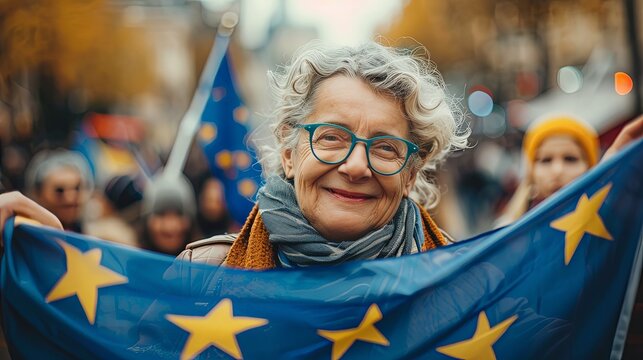 Old woman holding european union flag