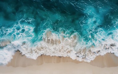 Aerial view of ocean waves hitting the beach