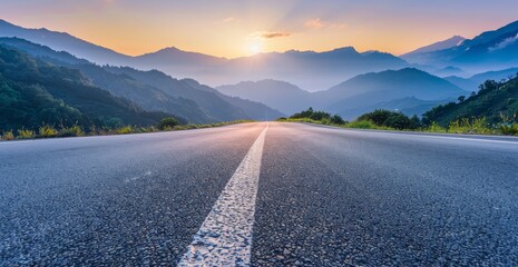 Empty asphalt road and beautiful mountain landscape with sun flare background 