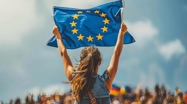 Young woman holding european union flag from behind