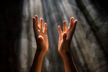 hands reaching up in the sunlight