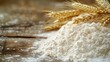 © buraratn - Pile of flour with golden ears of wheat on a rustic wooden table, showcasing freshly sifted ingredients