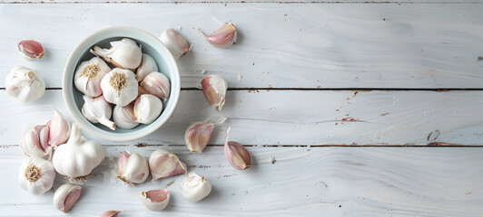 white Bowl with fresh garlic on grey textured background Composition Close up the group of garlic on kitchen wooden table healthy food eating with high antioxidants.