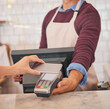 © peopleimages.com - Cafe, phone or hands of customer with man server for coffee shop pos payment, commerce and machine transfer. Restaurant, business or people with cashless transaction for food, shopping or service tip