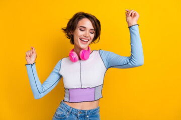 Poster - Photo of sweet lucky lady dressed shirt enjoying songs earphones dancing having fun isolated yellow color background